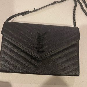 Bag has 3 scratches like new still worn 3x aunthebtic purchase from ysl store